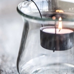 Sort holder til fyrfadslys fra Ib Laursen  i glas med lys - Tinashjem